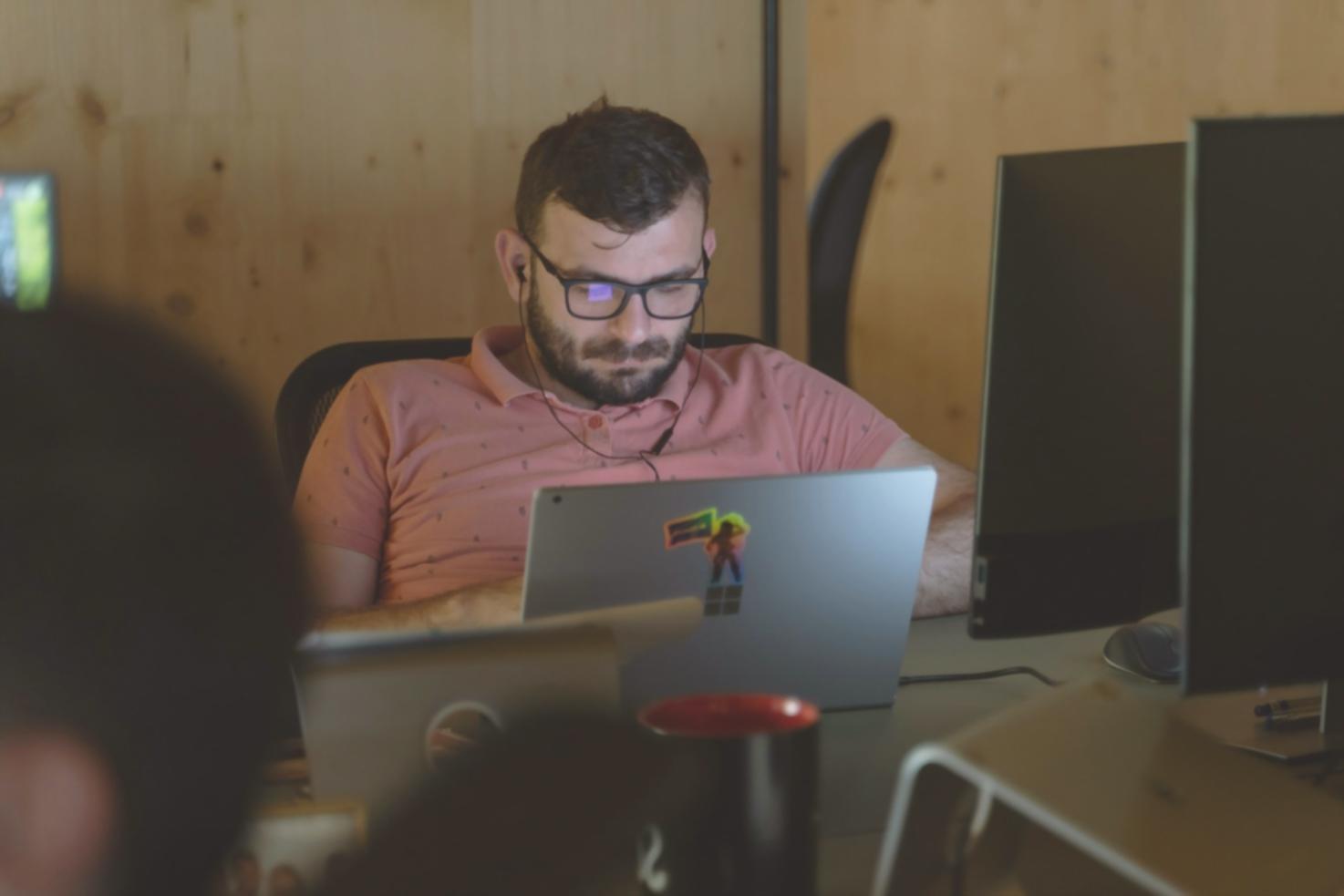 Person reviewing financial documents and budget planning materials