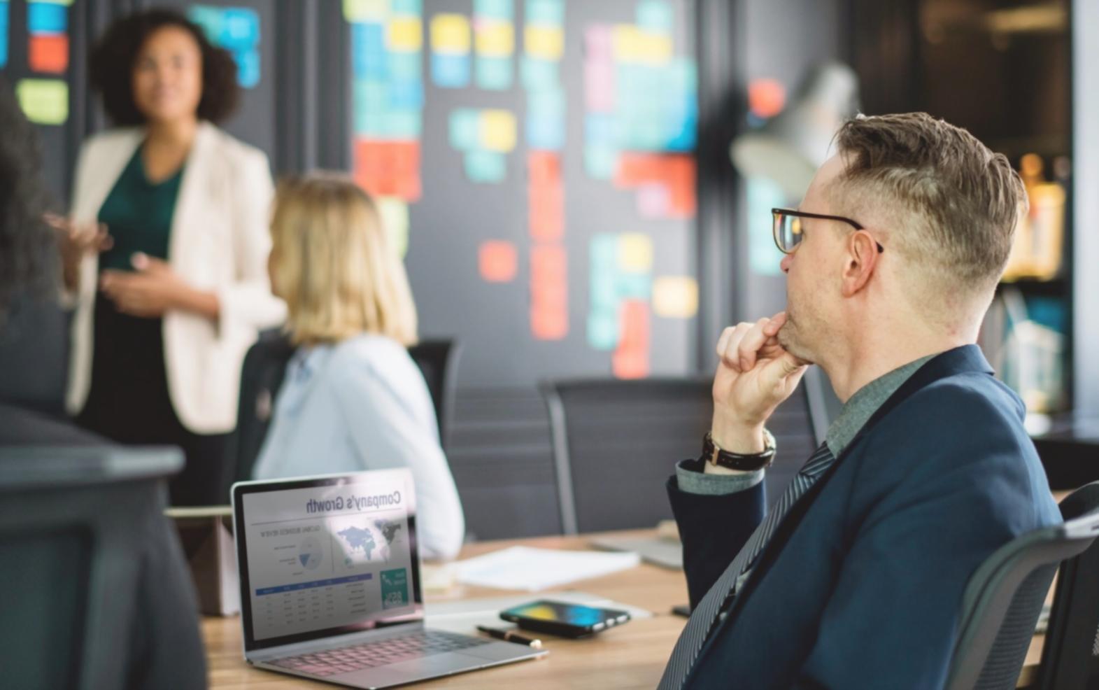 Participant reviewing budget planning materials and financial documents